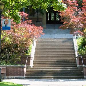 Front steps of Old Main flanked by trees
